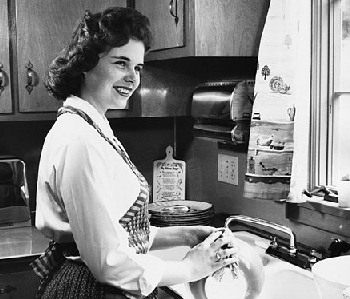 1950s Mom washing the dishes by hand.