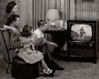 1950s family watching black-and-white TV.